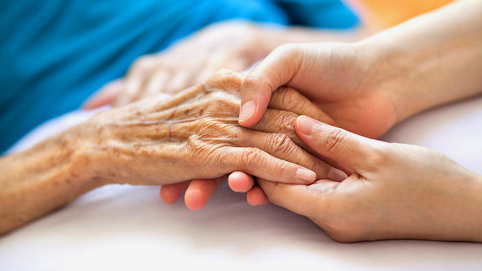 home carer with woman in wheelchair